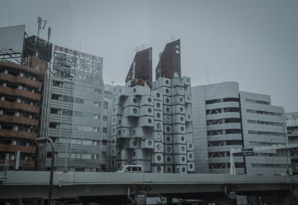 white concrete building under white sky during daytime